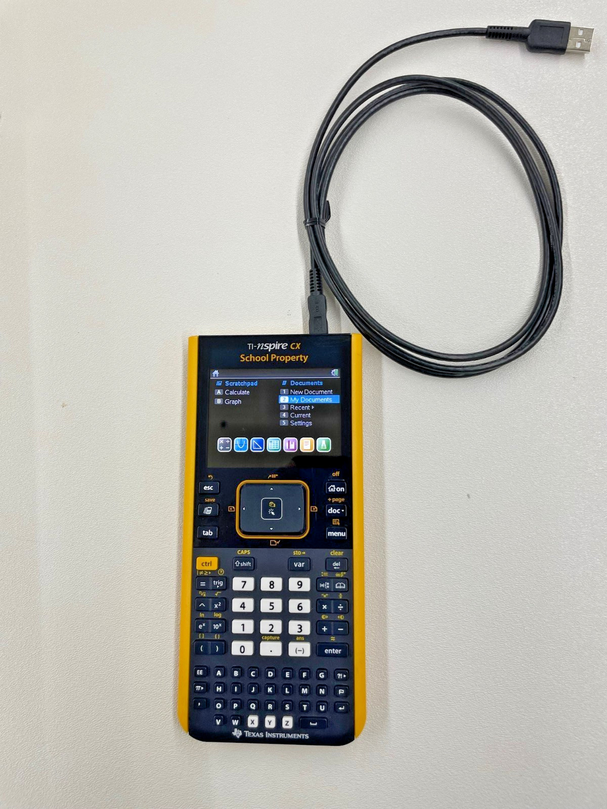 TI Nspire CX Color-Display Graphing Calculator with School Property Markings.